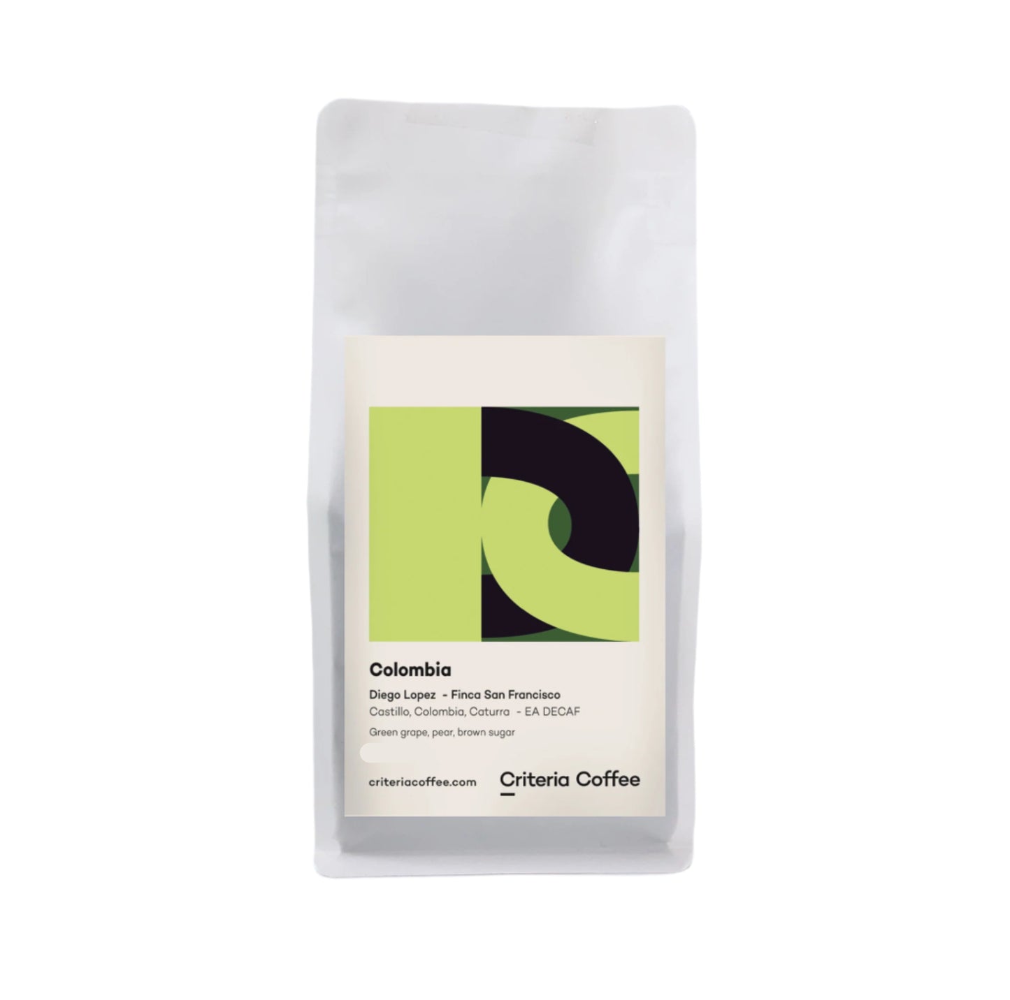 Criteria coffee. Colombia single origin decaf coffee. Roasted for espresso. Image shows a 1kg bag of the coffee against a white background. The label on the bag shows a modern abstract design that resembles the letter's D and C in a square frame using lime green, forest green and black in a colour blocking design. The label also features basic coffee information, including origin, farmer, tasting notes and the roaster. The Roast Collective.