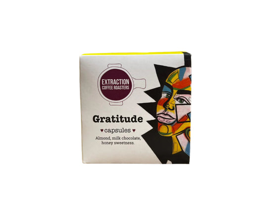 Extraction Coffee Roasters. Gratitude Capsules, for Nespresso compatible pod machines. The image shows a 10 pack box of capsules on a white background. The Roast Collective.