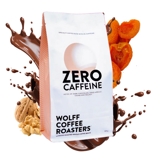 Roasted coffee beans. Wolff Coffee Roasters Zero Caffeine Blend 500g bag with fruit and nuts in background. The Roast Collective