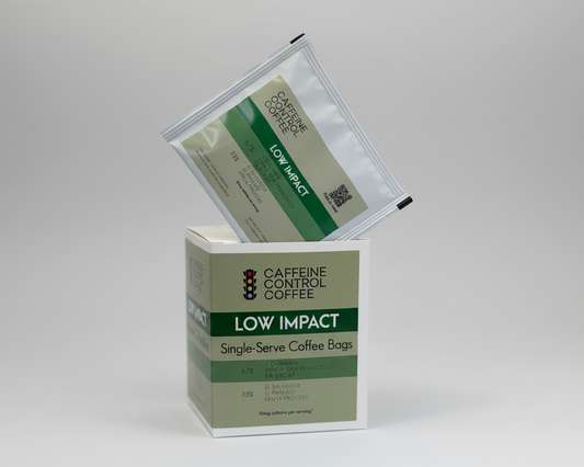 Caffeine Control Coffee Low Impact single-serve coffee bags with packaging on a white background