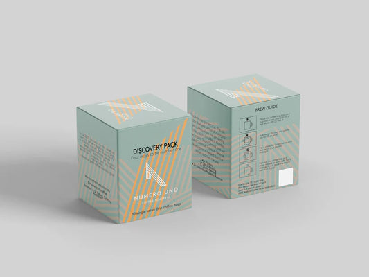 Coffee by The Roast Collective. Two green boxes labelled 'Numero Uno Discovery Pack' on a light grey background