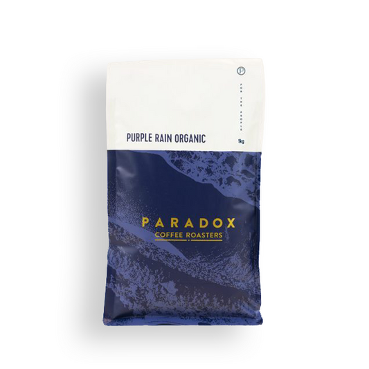 Roasted coffee beans Paradox Coffee Roasters Purple Rain Organic Blend The Roast Collective