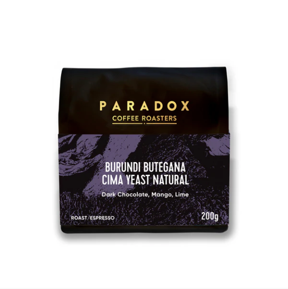 Paradox Coffee Roasters coffee package with purple and black design