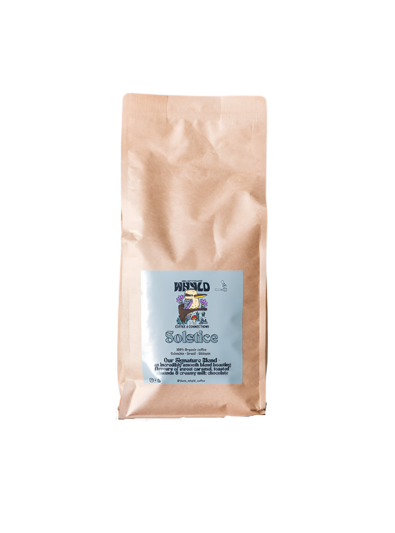 Roasted coffee beans from The Roast Collective. That's Whyld Coffee Roasters, Solstice Organic Blend. Image shows a brown 1kg bag of Solstice blend against a white background. The bag has a duck egg blue coloured label centred on the lower half of the bag with the roaster's logo, blend name, and blend details on it. 
